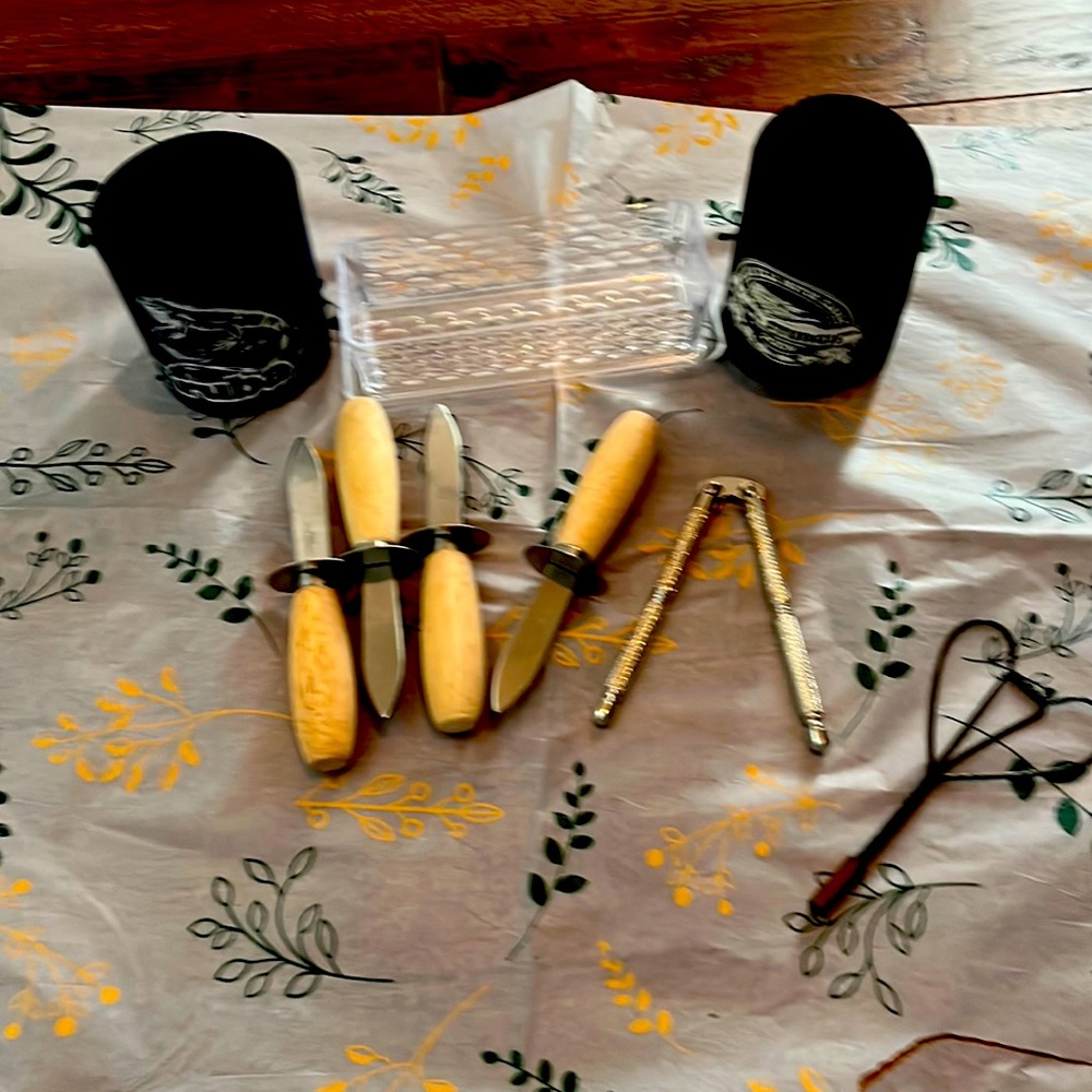 four oyster Shuckers, a butter, dish, plastic, nutcracker and two beer holders